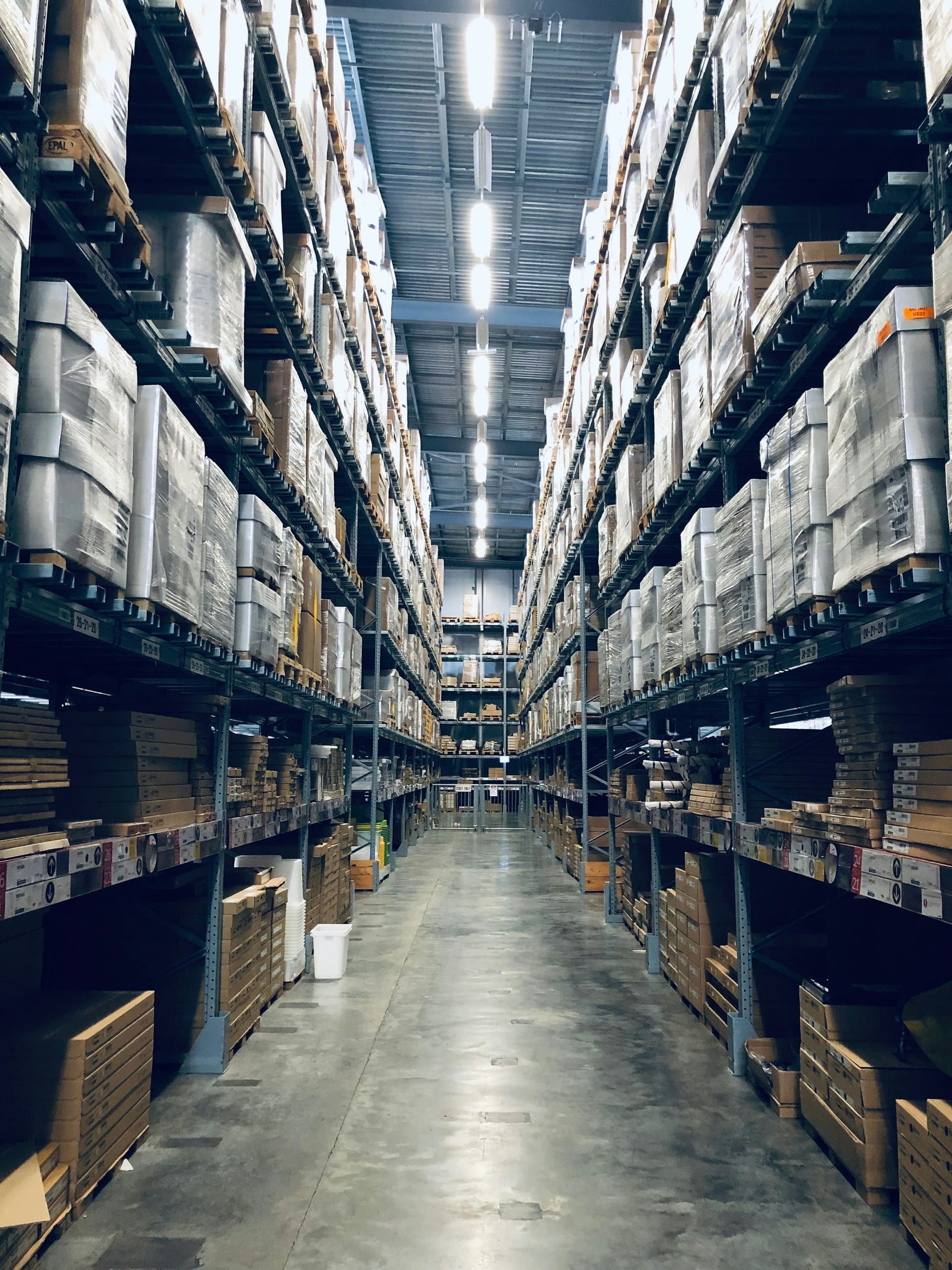 Long warehouse aisle with high racking