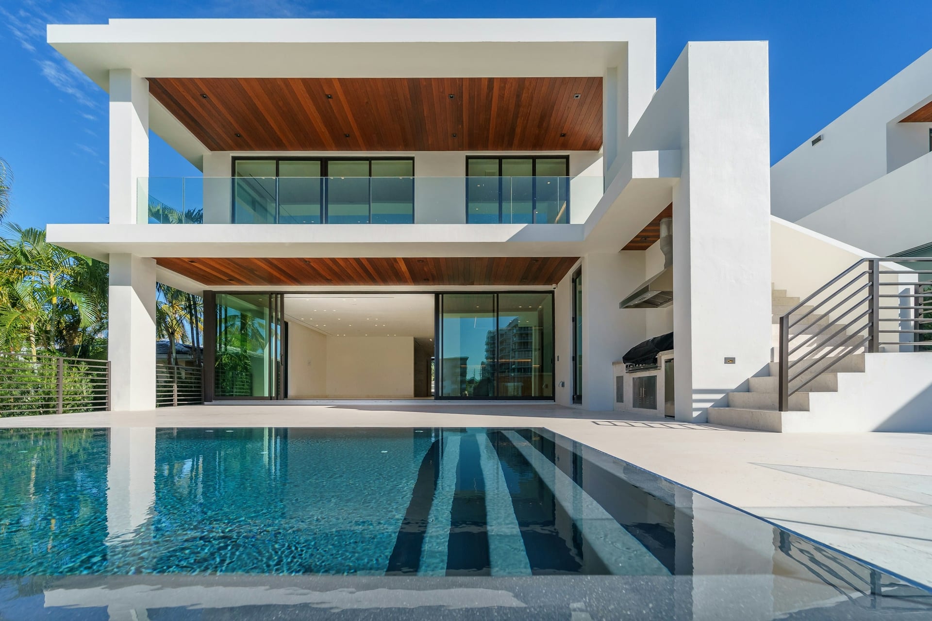 Luxury modern villa with timber soffits and glass balustrades